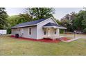 Charming gray home with manicured lawn, small porch, and modern siding at 3610 Hawkins Ave, Sanford, NC 27330