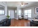 Inviting living room with hardwood floors, a ceiling fan, and lots of natural light at 3827 Heritage Spring Circle Cir, Wake Forest, NC 27587