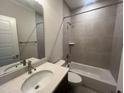 Modern bathroom with shower-tub combination and stylish vanity at 40 Wabash St, Pittsboro, NC 27312