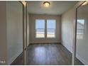 Versatile room featuring hardwood floors and double windows for ample natural light at 40 Wabash St, Pittsboro, NC 27312