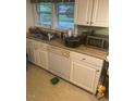 Functional kitchen features essential appliances and window views at 407 N Cheatham St, Franklinton, NC 27525