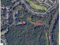 An aerial view of property location near Bridges Lake and Neuse River Greenway Trail with lush surrounding trees at 5420 Royal Troon Dr, Raleigh, NC 27604