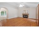 Spacious living room with vaulted ceiling, fireplace, and laminate flooring throughout at 5420 Royal Troon Dr, Raleigh, NC 27604