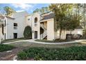 Well-maintained condo building featuring a charming exterior and landscaped surroundings at 6011 Winterpointe Ln # 205, Raleigh, NC 27606