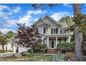 Charming two-story home with landscaped front yard and inviting entrance with brick steps at 733 Hadrian Dr, Garner, NC 27529