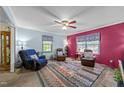 Inviting living room with ample natural light, featuring a colorful rug and comfortable seating at 820 Nuttree Pl, Raleigh, NC 27606