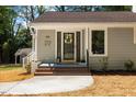 Charming front entrance with a decorative wreath and fresh landscaping at 106 Circle Dr, Mebane, NC 27302