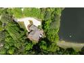 Stunning aerial view of the home with lush greenery and lake views at 116 Hibiscus Dr, Clayton, NC 27527