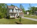 Attractive two-story home with well-kept landscaping and a welcoming covered porch at 130 Hilldebrant Dr, Franklinton, NC 27525