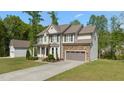 Beautiful two-story home with stone-accented garage and a well-maintained lawn at 130 Hilldebrant Dr, Franklinton, NC 27525