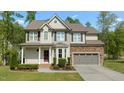 Charming two-story home with manicured lawn, neutral siding, and a covered porch at 130 Hilldebrant Dr, Franklinton, NC 27525