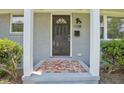 Close-up of the front door with address, showcasing a charming tiled landing and a welcoming entrance at 1708 S Alston Ave, Durham, NC 27707