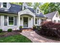 Inviting front entrance with a stone walkway and stylish front door at 202 Homestead Dr, Cary, NC 27513