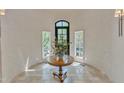 Bright foyer featuring a round table with floral arrangement and a leaded glass window at 2117 Buckingham Rd, Raleigh, NC 27607