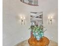 Open foyer with decorative table, leading to living areas and staircase at 2117 Buckingham Rd, Raleigh, NC 27607