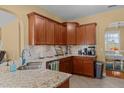 The kitchen features granite countertops, lots of cabinet space, and stainless steel appliances at 244 N Prince Henry Way, Cameron, NC 28326