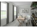 Comfortable home office with neutral decor and large windows for natural light at 294 N Coral Bells Way, Four Oaks, NC 27524