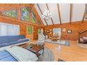 Cozy living room features soaring ceiling, wood paneling, and open layout at 300 Rabbit Run, Pittsboro, NC 27312