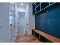 Well-organized mudroom with a built-in bench and cubbies for storage at 3004 Eden Harbor Ct, Raleigh, NC 27613