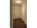 Entryway with laminate floors, a closet, and a ceiling light at 403 Gooseneck Dr # A-1, Cary, NC 27513