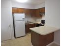 Functional kitchen featuring a peninsula island, and stainless steel appliances at 403 Gooseneck Dr # A-1, Cary, NC 27513