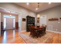 Traditional dining room featuring hardwood floors, a chandelier, and a vintage china cabinet at 4331 Millcreek Cir, Pittsboro, NC 27312