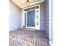 Inviting front door with brick steps, enhanced by sidelights and a transom window at 4331 Millcreek Cir, Pittsboro, NC 27312