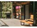 Outdoor patio featuring a grill, seating, and stylish door, great for enjoying the outdoors at 665 Lonach Ln, Roxboro, NC 27574