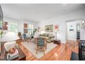 Bright living room featuring hardwood floors, white walls, and lots of natural light at 708 Copperline Dr # 101, Chapel Hill, NC 27516