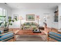 Living room with hardwood floors, white walls, cozy seating, and stylish décor at 708 Copperline Dr # 101, Chapel Hill, NC 27516