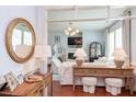 Inviting living room showcasing wood floors and an open doorway to a living room with modern décor at 715 Barlang Cir, Fuquay Varina, NC 27526