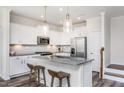 Beautiful kitchen with stainless steel appliances, a center island, and pendant lighting at 718 Colby Pl, Durham, NC 27713