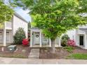 Inviting home exterior with a cozy front porch, perfect for relaxing and enjoying the neighborhood views at 7829 Acc Blvd, Raleigh, NC 27617