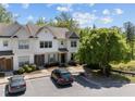 Street view of two-story townhome with parking and well-maintained landscaping at 7851 Allscott Way, Raleigh, NC 27612
