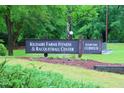 Kildaire Farms community sign for the fitness and racquetball center and the clubhouse on a grassy lawn at 104 Silver Fox Ct, Cary, NC 27511