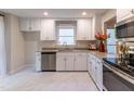 Beautiful kitchen with white cabinets, stainless steel appliances, and granite countertops at 104 Silver Fox Ct, Cary, NC 27511