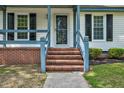 Inviting brick steps leading to a bright and cheerful entrance, framed by neatly trimmed shrubs at 1100 Brandywine Ln, Rocky Mount, NC 27804