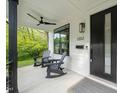 Comfortable front porch featuring rocking chairs and ceiling fan at 1202 S Bloodworth St, Raleigh, NC 27601