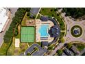 Community aerial view showcasing pool, tennis courts, playground and walking paths in a park-like setting at 1322 Regulator St, Raleigh, NC 27603