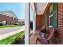 Inviting porch with brick detailing, comfortable seating, and views of the neighborhood at 1322 Regulator St, Raleigh, NC 27603