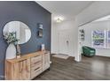 Home Foyer featuring gray accent wall with wood toned credenza and round mirror at 1410 Arena Ln, Fuquay Varina, NC 27526