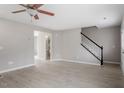 Bright living room with light wood floors and staircase at 197 Scranton Ct, Cameron, NC 28326
