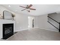 Living room featuring a decorative fireplace, light wood floors, and open floor plan at 197 Scranton Ct, Cameron, NC 28326