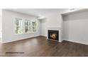 Cozy living room with hardwood floors and a fireplace at 200 Pretty Run Branch Ln, Wendell, NC 27591