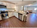 Modern kitchen with stainless steel appliances and granite countertops at 2101 S Roxboro St, Durham, NC 27707