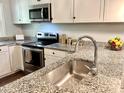 Close up of the stainless sink and countertop of the renovated kitchen at 2101 S Roxboro St, Durham, NC 27707