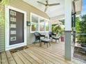 Inviting front porch with seating, offering a relaxing outdoor space to enjoy the neighborhood views at 2128 Watkins St, Raleigh, NC 27604