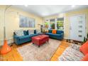 Cozy living room with natural light, hardwood floors, and comfortable seating arrangement at 2128 Watkins St, Raleigh, NC 27604