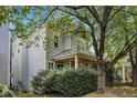 A beautifully landscaped home featuring mature trees and lush greenery at 2157 Dunn Rd, Raleigh, NC 27614