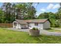 White brick ranch-style home with a well-maintained yard at 226 Smith Dr, Durham, NC 27712